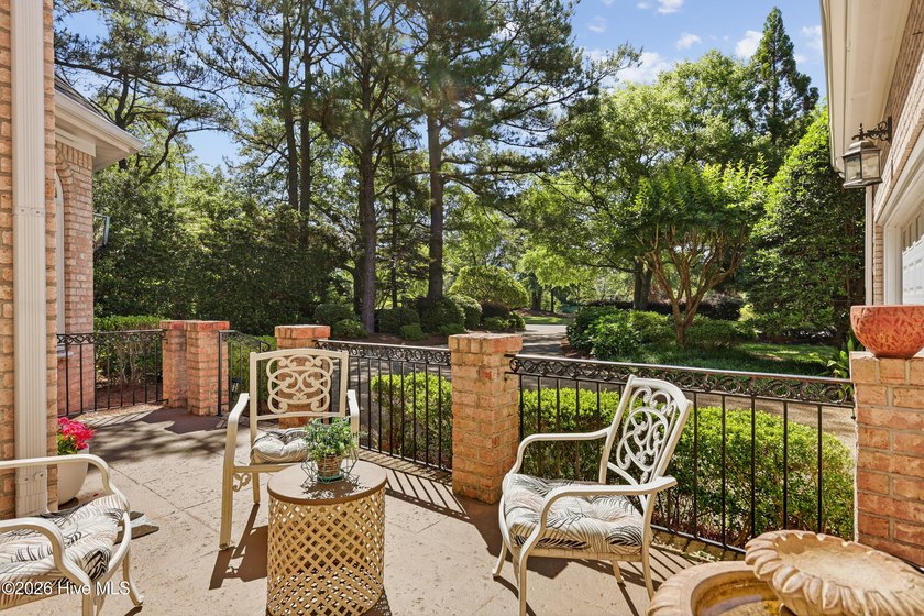 Set within the prestigious community of Landfall, this elegant - photo 8