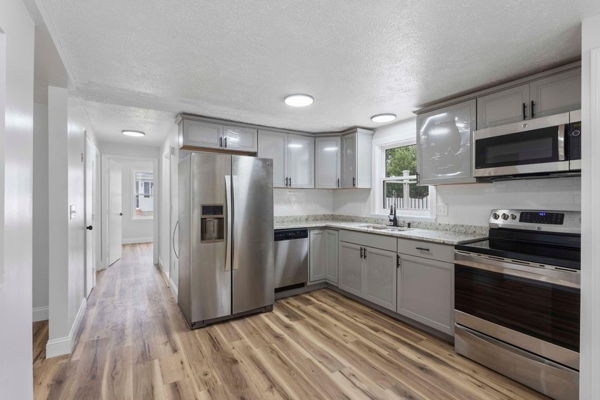 Thoughtful renovations inside and out give this Kennebunk Cape a - photo 8