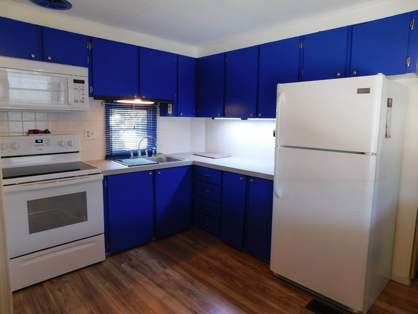 This well-maintained 2-bedroom, 1.5-bathroom home comes - photo 3
