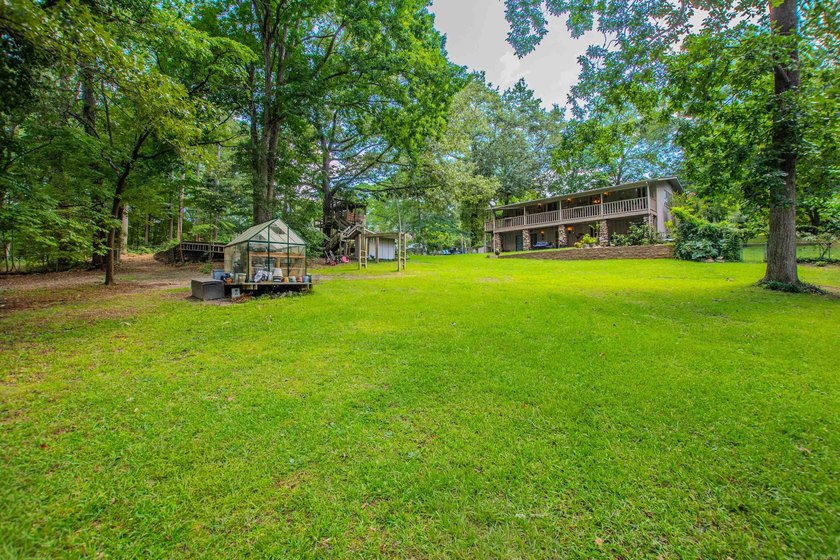 This Beautiful home sits on 2 manicured city lots with small - photo 44