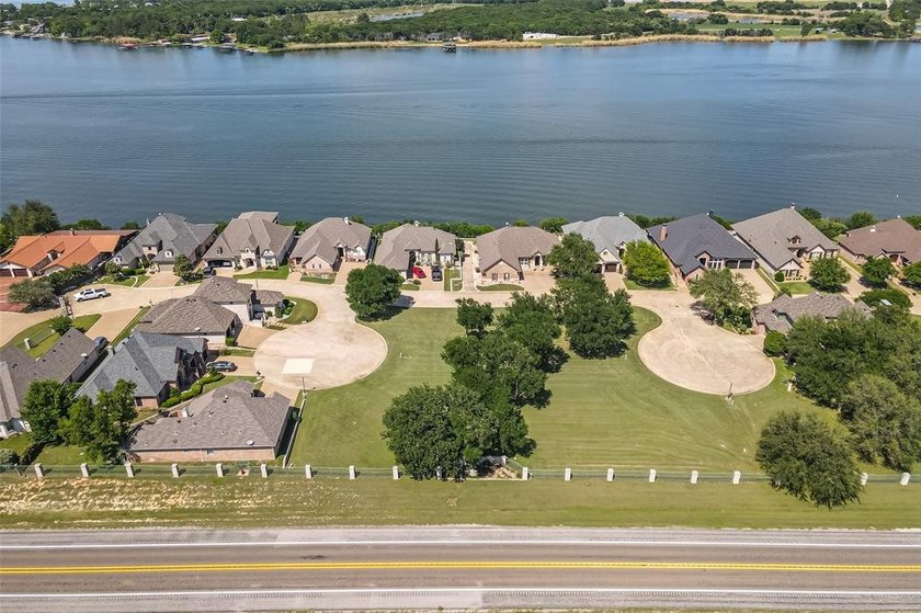 Nestled on a quiet street within the prestigious gated Bluff - photo 7