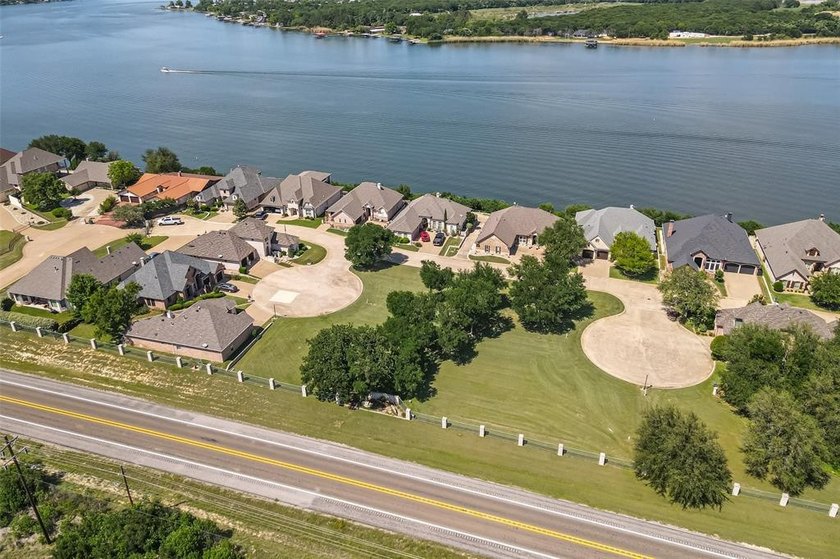 Nestled on a quiet street within the prestigious gated Bluff - photo 8