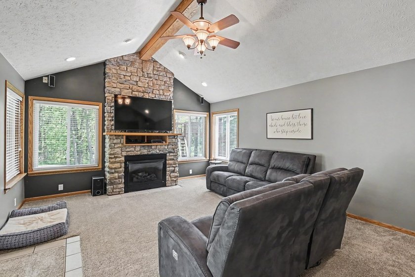 Tucked among the trees on 2 scenic acres just outside the - photo 4