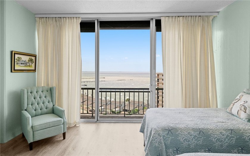 Wake up to sweeping ocean views from this beautifully refreshed - photo 13