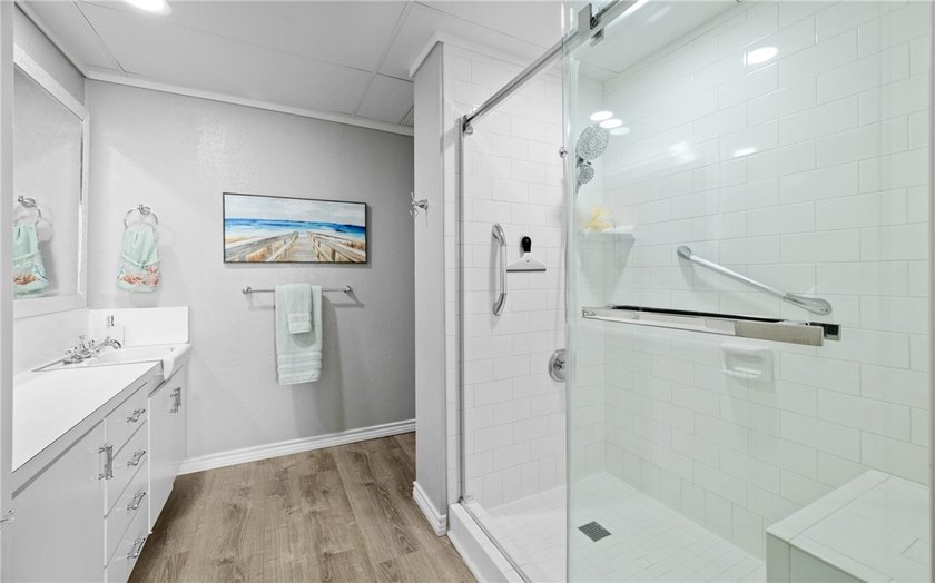 Wake up to sweeping ocean views from this beautifully refreshed - photo 16