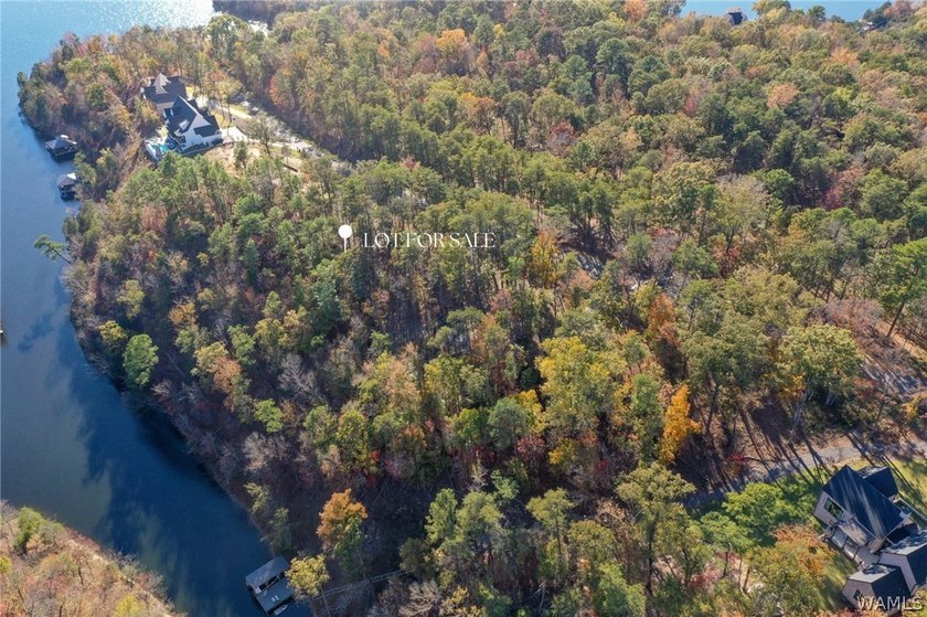 Discover a rare opportunity to own 1.21 +/- acres of lakefront - photo 2