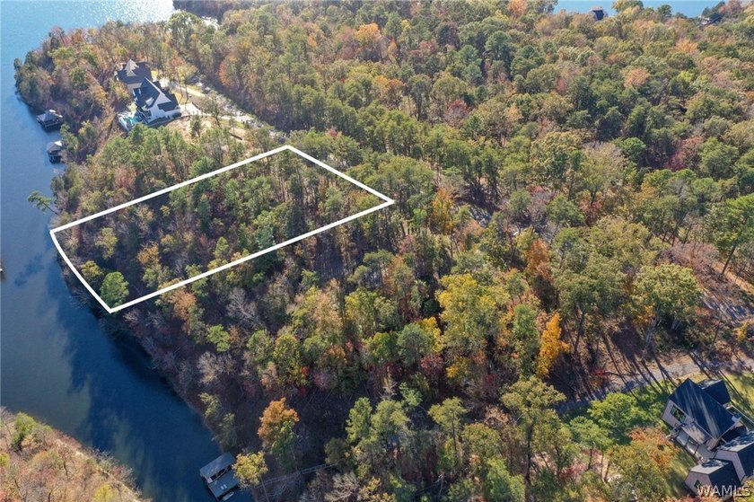 Discover a rare opportunity to own 1.21 +/- acres of lakefront - photo 3