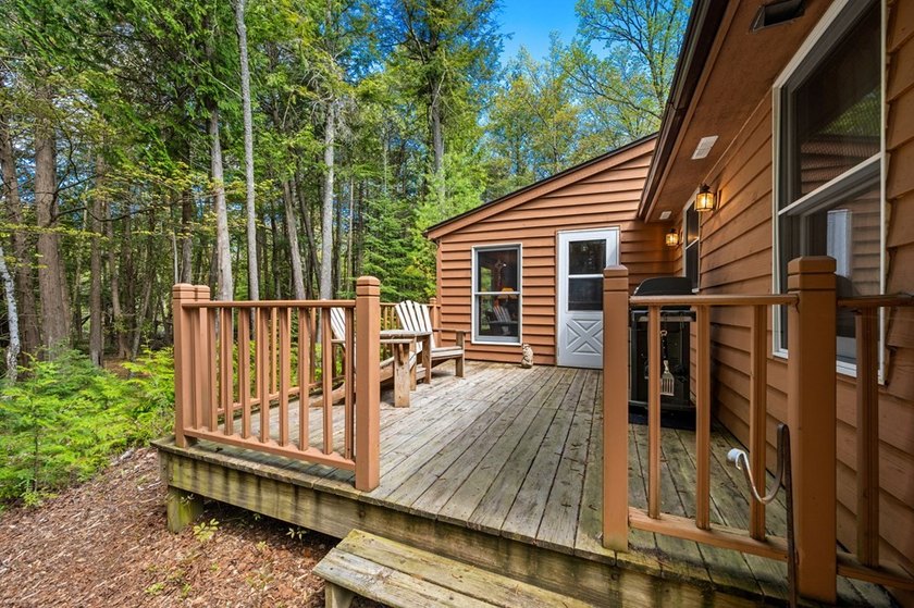 Tucked away in the woods and just a short walk from deeded water - photo 17