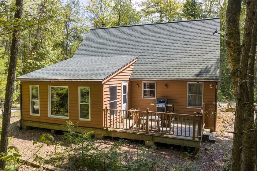 Tucked away in the woods and just a short walk from deeded water - photo 26