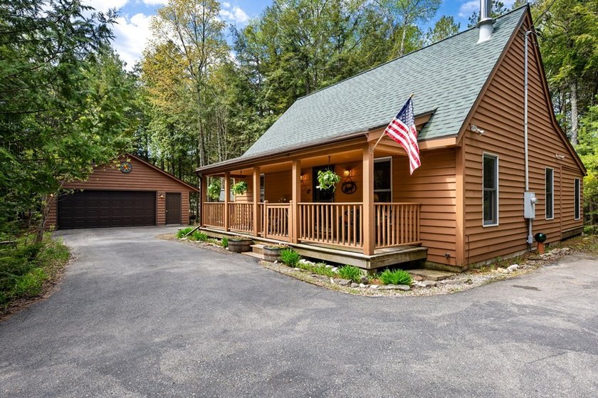 Tucked away in the woods and just a short walk from deeded water - photo 32