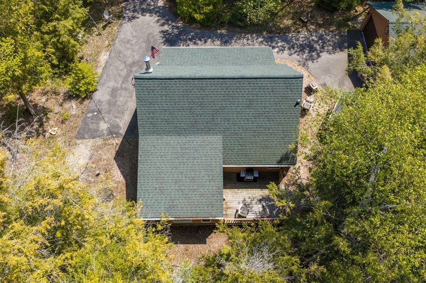 Tucked away in the woods and just a short walk from deeded water - photo 34
