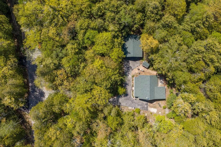 Tucked away in the woods and just a short walk from deeded water - photo 39