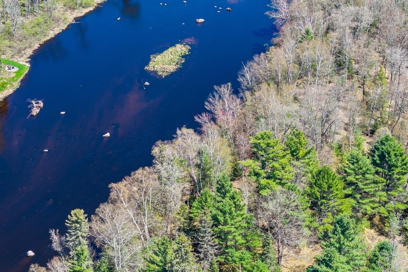 This 1.16-acre wooded parcel with 210 feet of frontage on the - photo 11