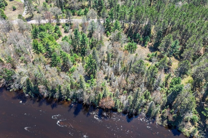 This 1.16-acre wooded parcel with 210 feet of frontage on the - photo 22