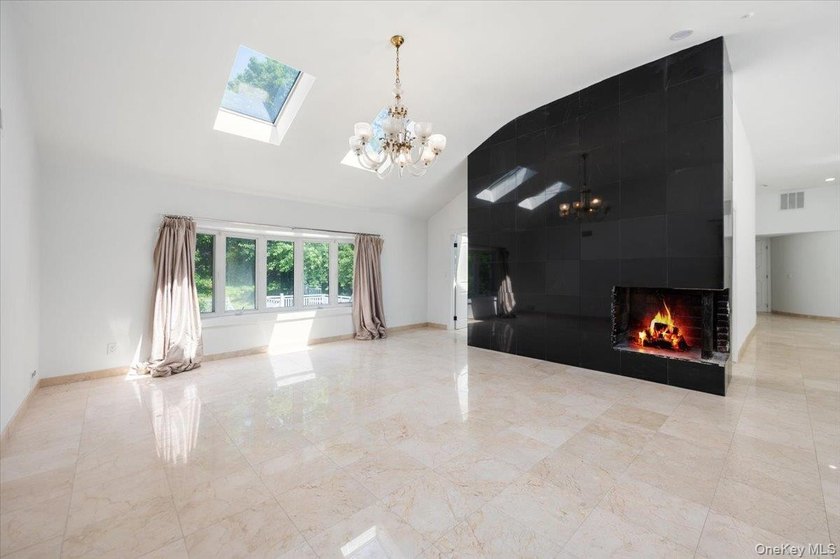 Welcome to this sprawling sunlit ranch with vaulted ceilings and - photo 7