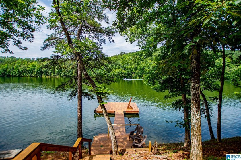 THIS LAKE FRONT HOME WITH AN OPEN FLOOR PLAN OFFERS COMFORT AND - photo 12