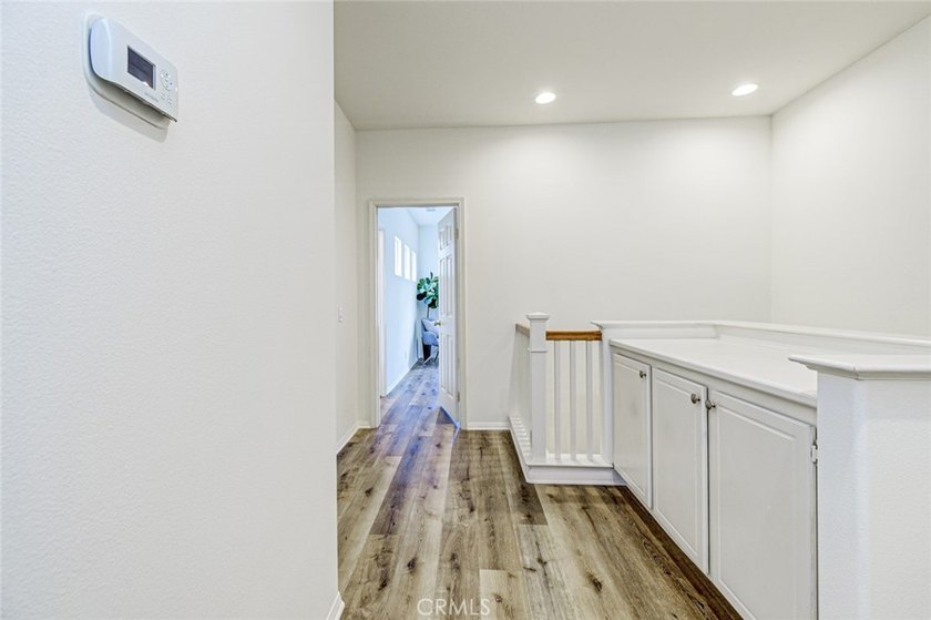 RARE DUAL PRIMARY LAYOUT! Welcome to effortless luxury living in - photo 13