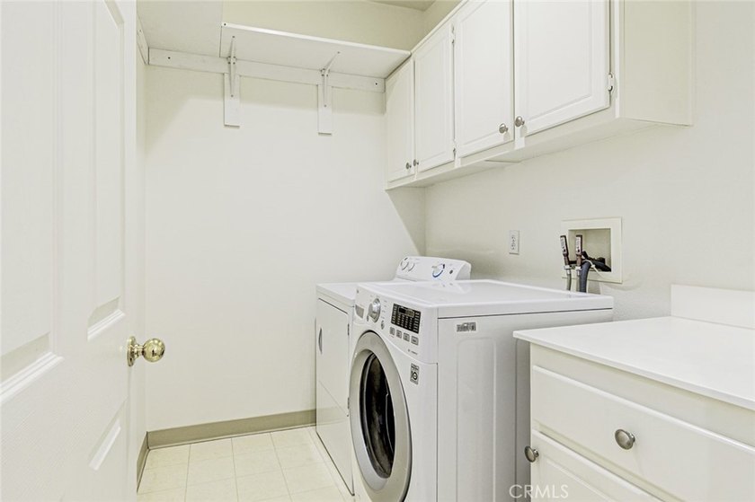 RARE DUAL PRIMARY LAYOUT! Welcome to effortless luxury living in - photo 14