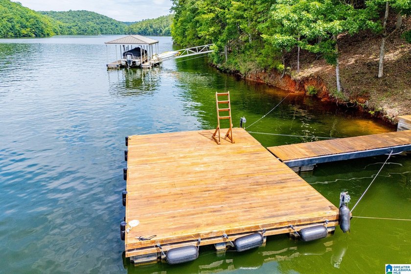 THIS LAKE FRONT HOME WITH AN OPEN FLOOR PLAN OFFERS COMFORT AND - photo 19
