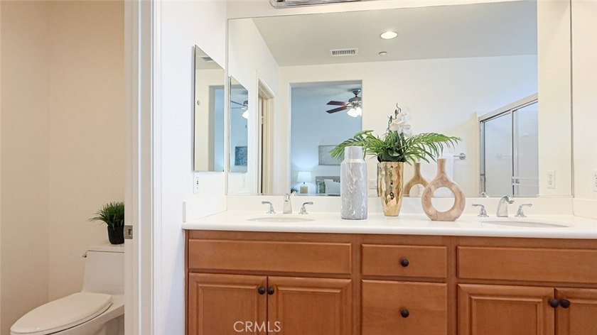 RARE DUAL PRIMARY LAYOUT! Welcome to effortless luxury living in - photo 20