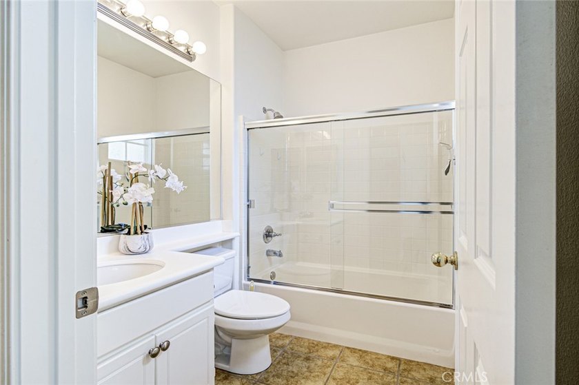RARE DUAL PRIMARY LAYOUT! Welcome to effortless luxury living in - photo 26