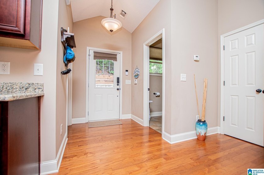 THIS LAKE FRONT HOME WITH AN OPEN FLOOR PLAN OFFERS COMFORT AND - photo 30