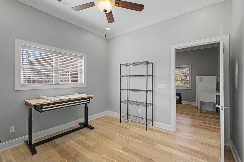 Step into this custom English-inspired one-level home, nestled - photo 46