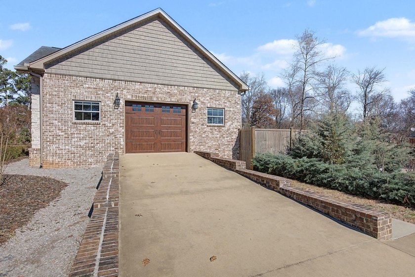 Step into this custom English-inspired one-level home, nestled - photo 50