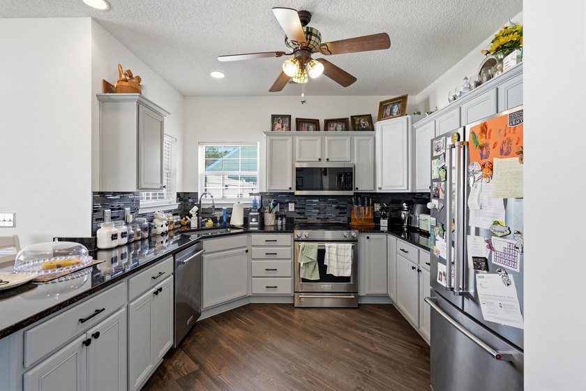 Welcome to this charming 3-bedroom, 2-bath home offering an - photo 11