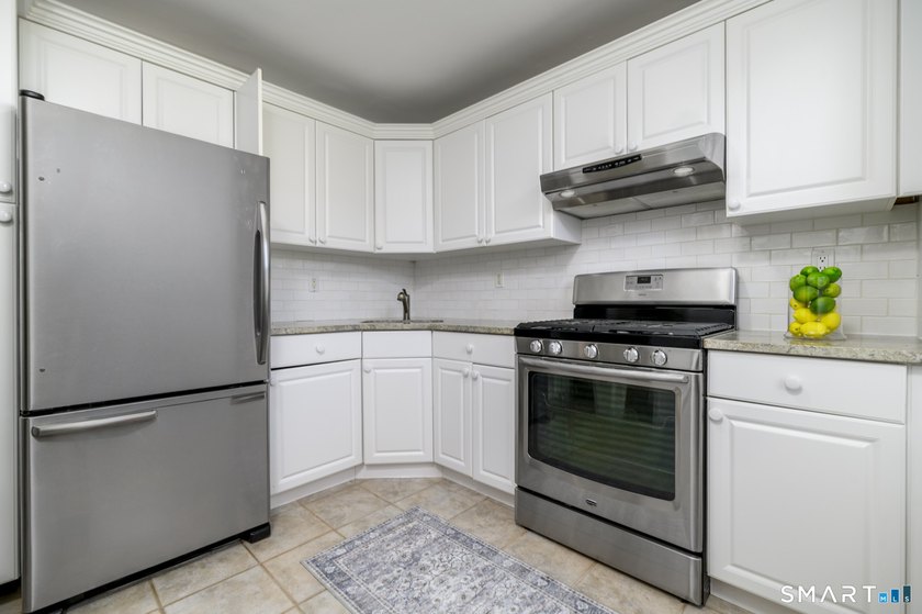 Perched just under the top floor, this stunning 2BR/1BA condo - photo 2