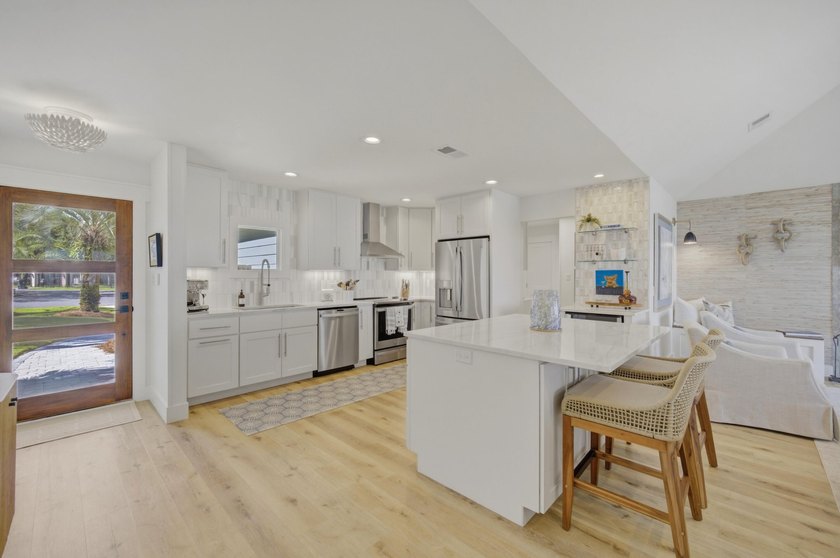 Beautifully remodeled coastal home featuring a private dock - photo 19