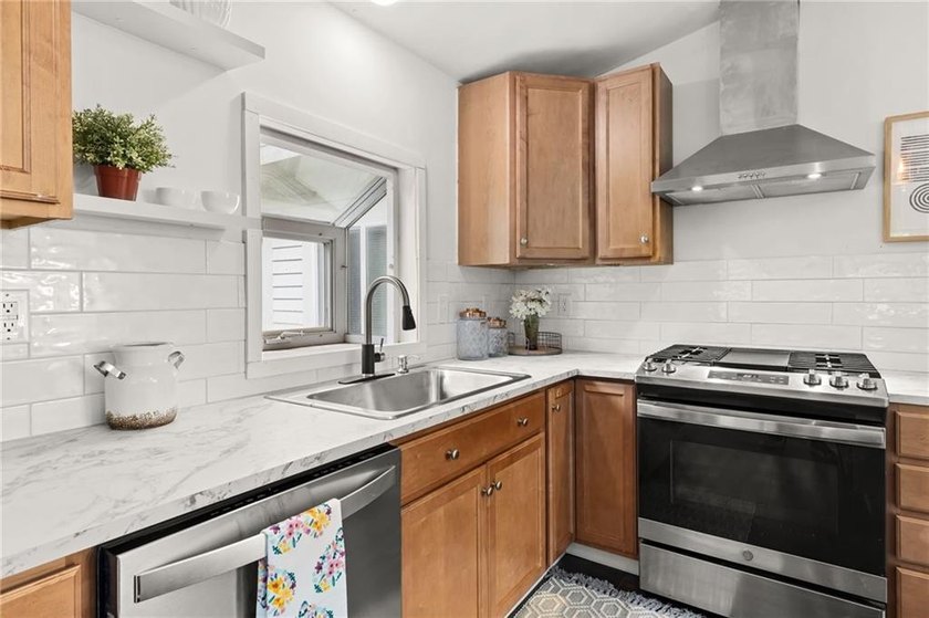 Tucked away in a peaceful setting, this three-bedroom - photo 14