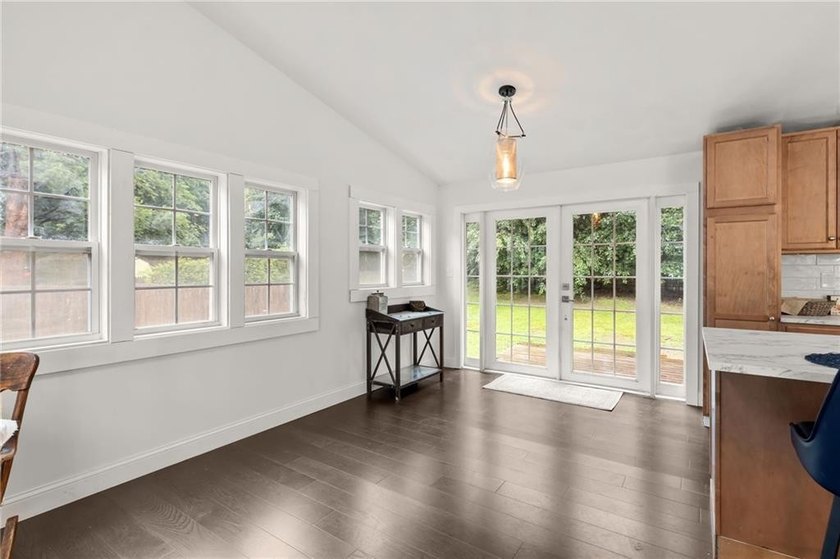 Tucked away in a peaceful setting, this three-bedroom - photo 16