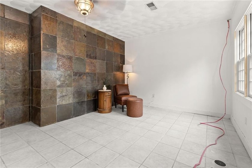 Tucked away in a peaceful setting, this three-bedroom - photo 35
