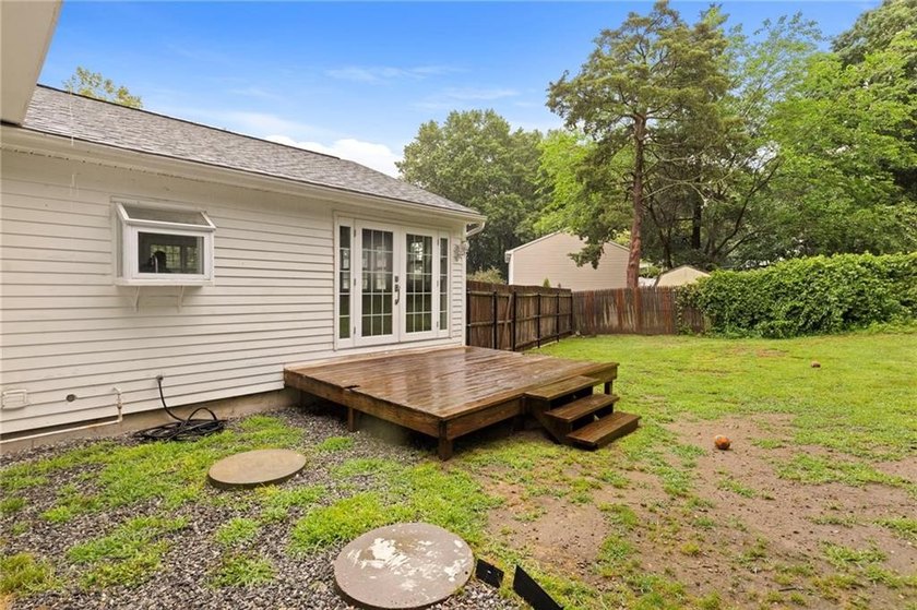 Tucked away in a peaceful setting, this three-bedroom - photo 47