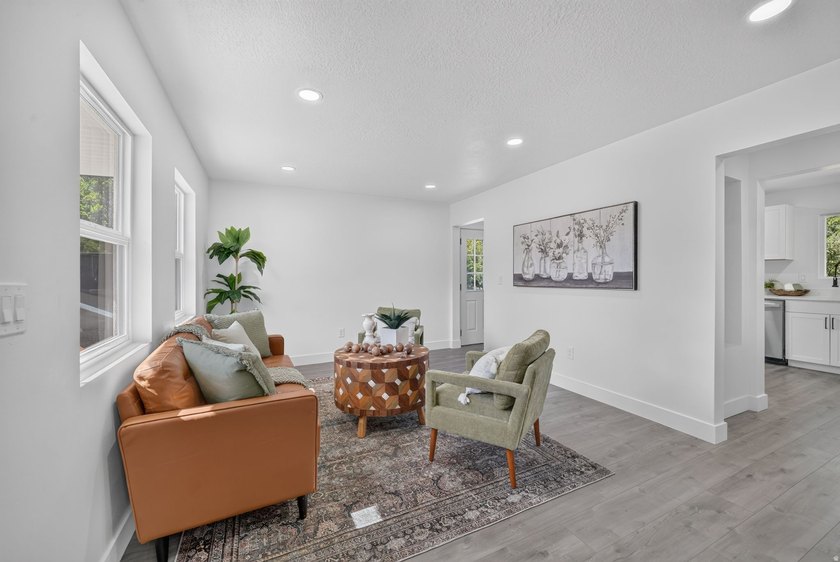 Fresh, updated, and move-in ready! This 4-bedroom, 2-bath home - photo 3