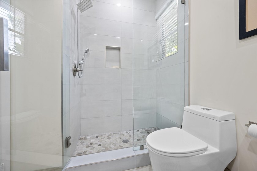 Fully renovated and move-in ready, this stunning villa offers - photo 22