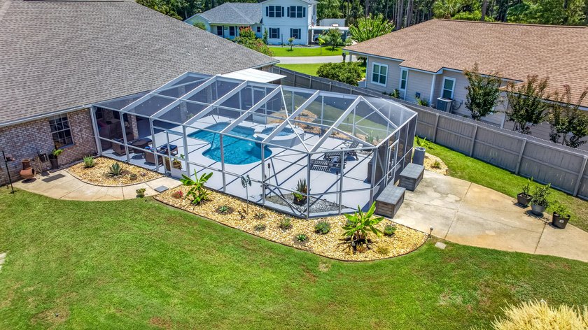 Nestled on a .54 acre corner cul-de-sac lot in the gated - photo 23