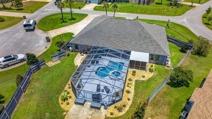 Nestled on a .54 acre corner cul-de-sac lot in the gated - photo 25