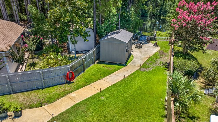 Nestled on a .54 acre corner cul-de-sac lot in the gated - photo 26