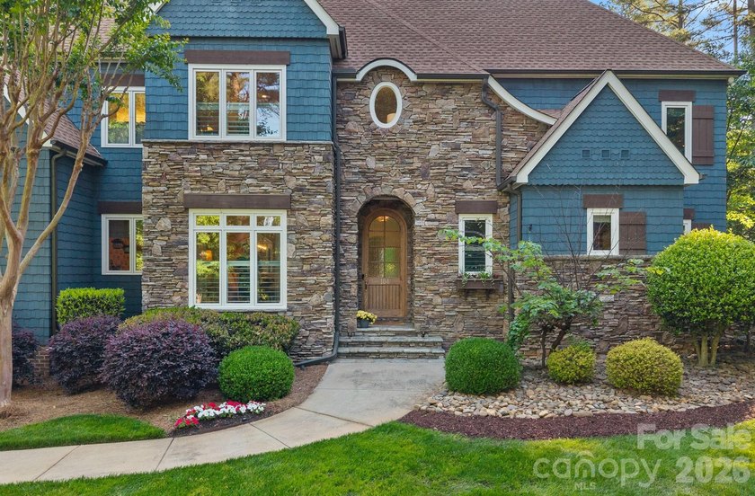 Set on a beautifully landscaped corner lot in a highly - photo 4