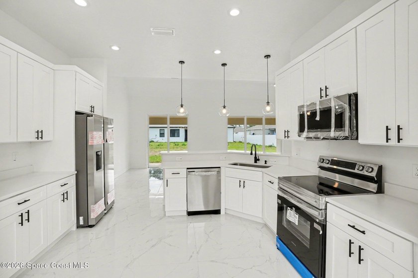 This beautifully designed 4 bed 2 bath concrete block home - photo 3