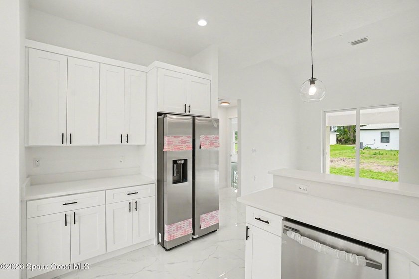This beautifully designed 4 bed 2 bath concrete block home - photo 4