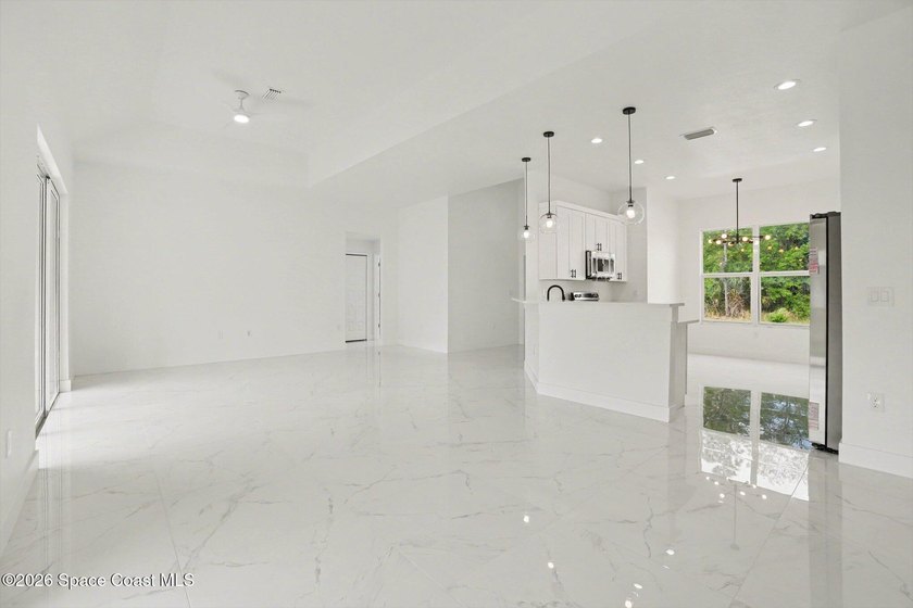 This beautifully designed 4 bed 2 bath concrete block home - photo 8