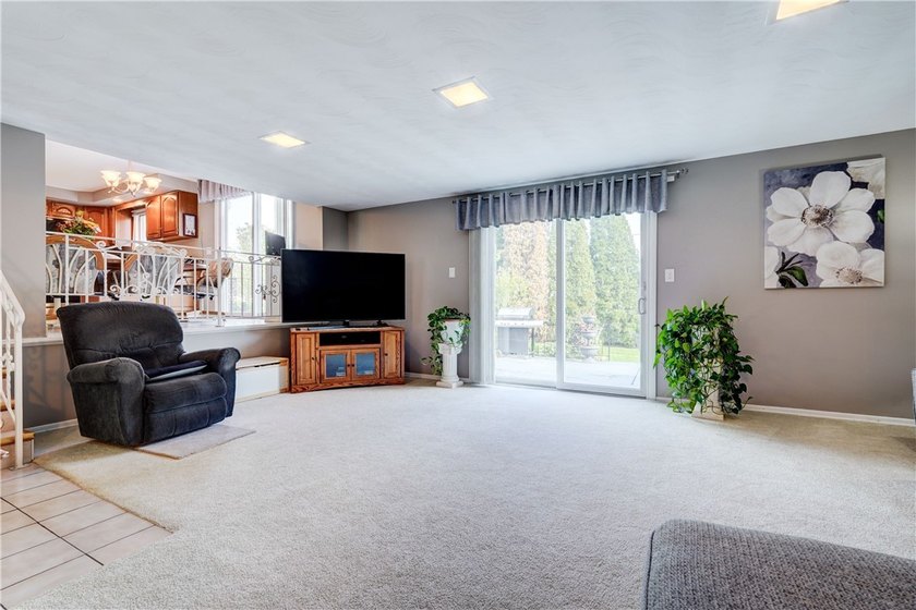 Welcome to this well-maintained split level home in Gates. Lots - photo 13