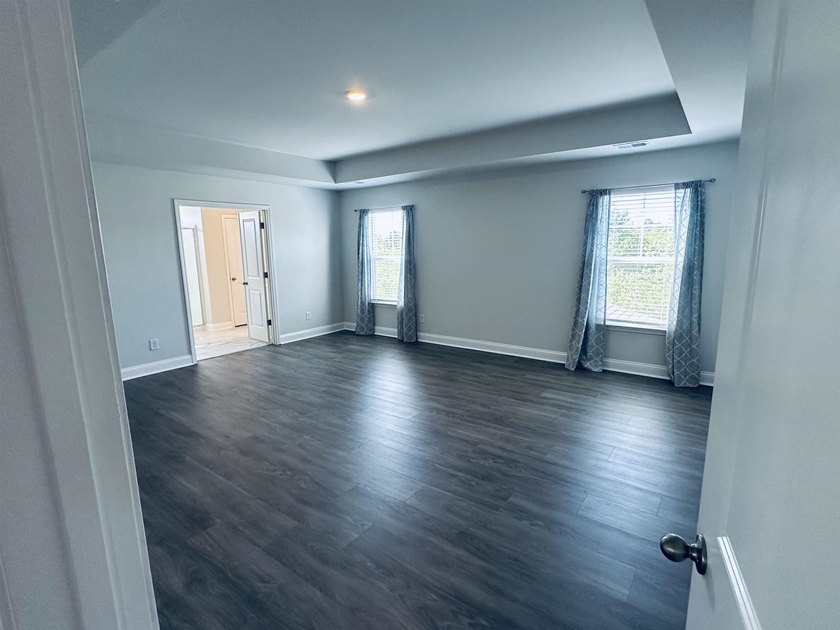 This Westerly home is a unique plan with a formal living and - photo 13