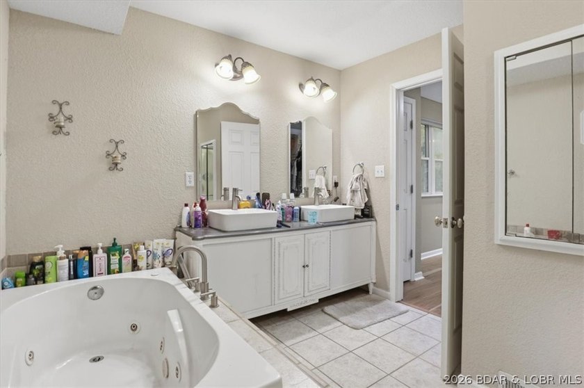This stunning 4-bedroom, 3-bathroom lake home offers the perfect - photo 13
