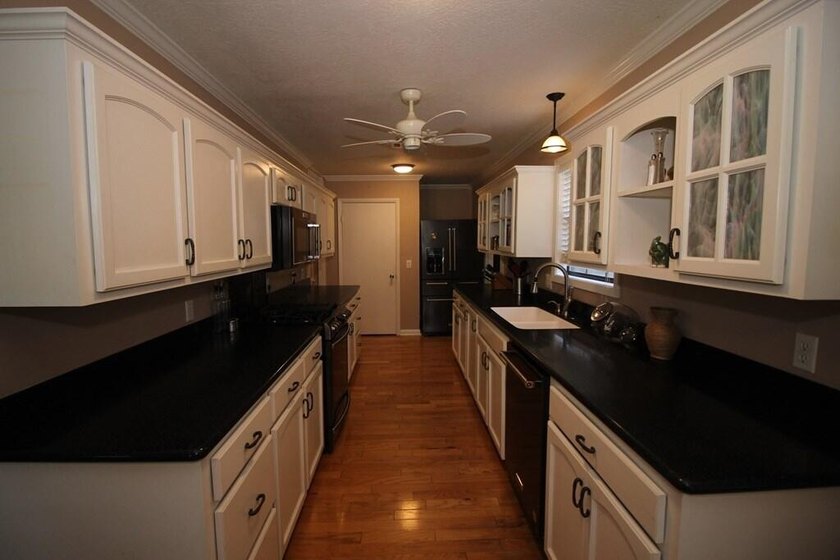 Tucked away in a quiet, private setting, this move-in-ready home - photo 11