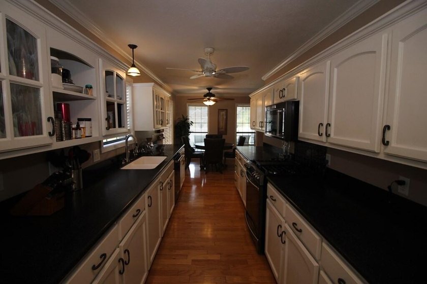 Tucked away in a quiet, private setting, this move-in-ready home - photo 14