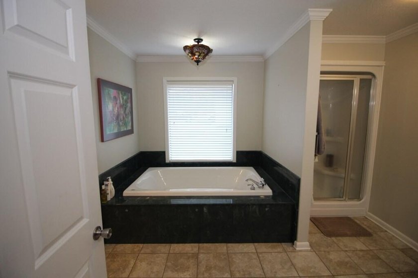 Tucked away in a quiet, private setting, this move-in-ready home - photo 42